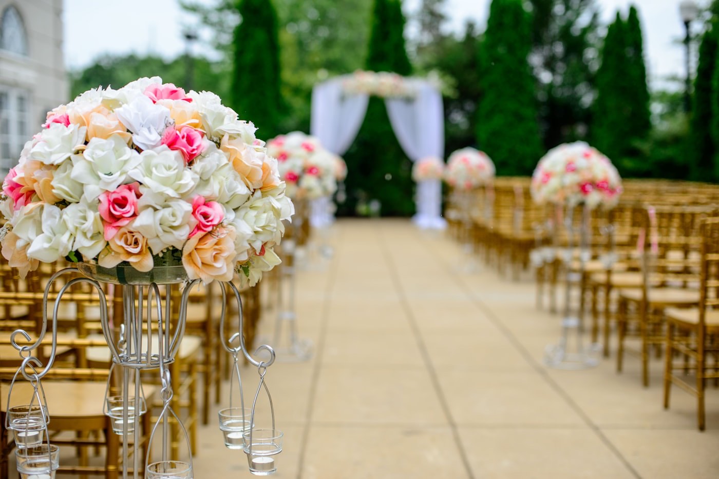 Ceremony aisle pedestals in blush and cream