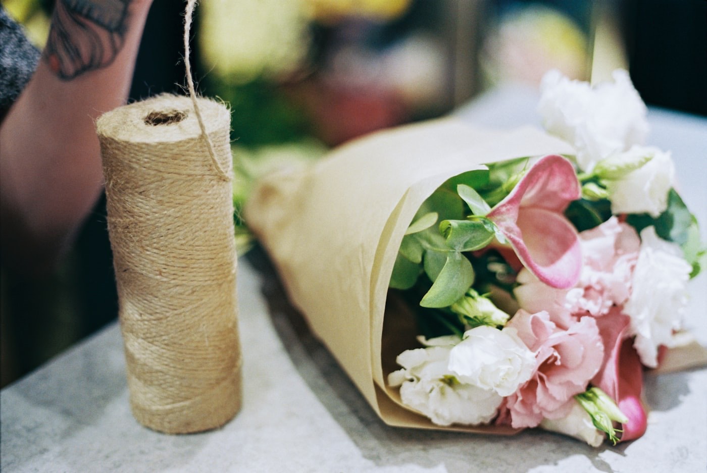 A bouquet wrapped in paper, ready to be delivered