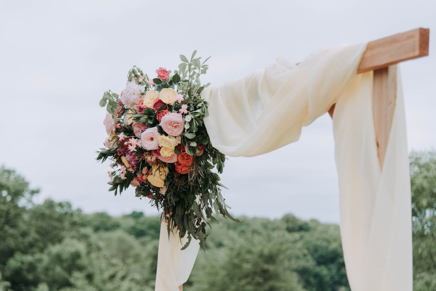 A blush bouquet carried at a wedding